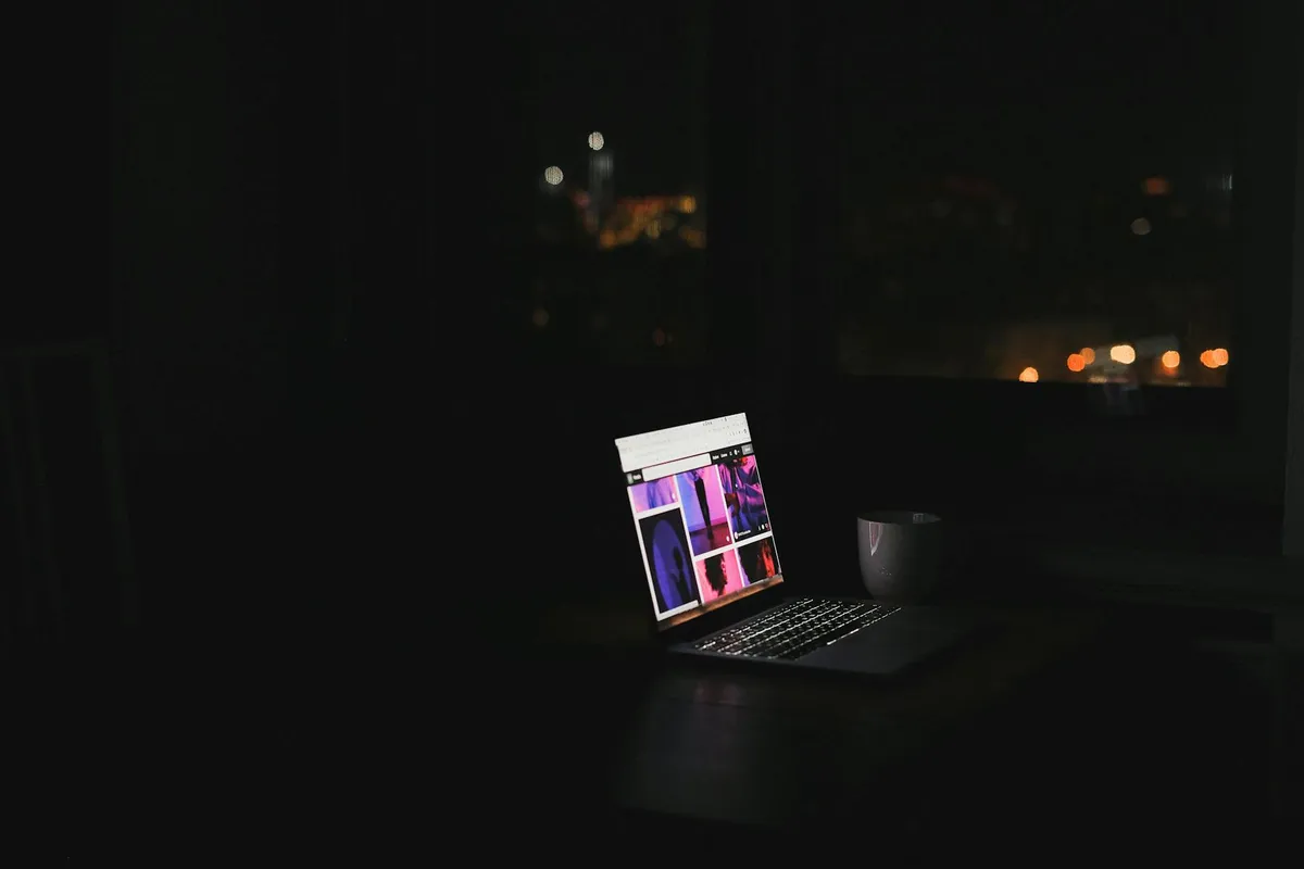 A laptop screen at night